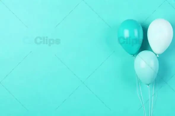 Teal Balloons Against a Soft Teal Background