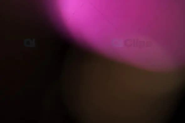 Vibrant Pink Light Leak with Soft Blur on Dark Background