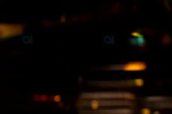 Dark Ambient Bokeh Lights with Subtle Color Accents