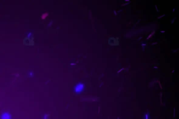 Glowing Purple and Blue Sparks – Mystical Particle Motion Effect
