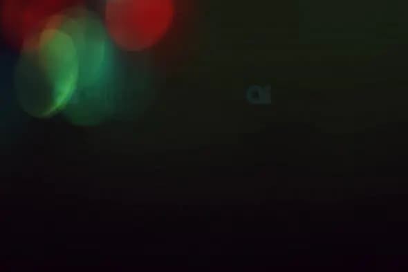 Minimalist Red and Green Bokeh Lights for Artistic Motion Graphics