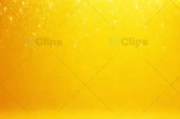 Bright Yellow Sparkling Background with Glowing Particles