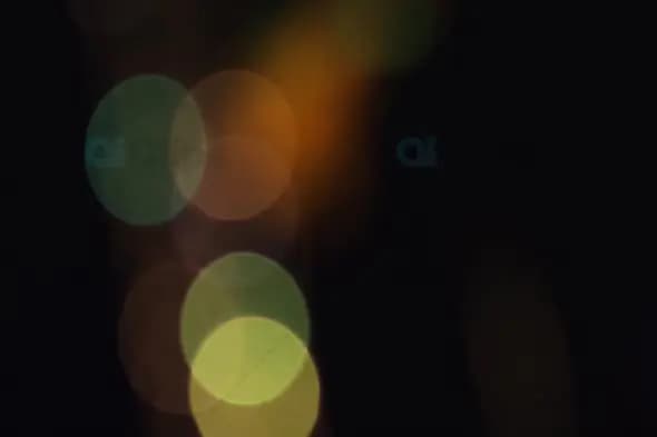 Soft Green and Orange Bokeh Lights for Atmospheric Motion Graphics
