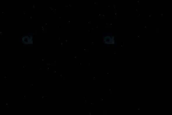 Sparse Snowflakes on Black Background – Light Winter Particle Effect