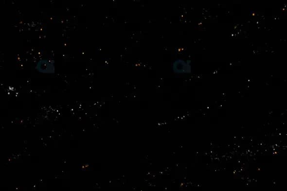 Glowing White and Orange Particles on a Black Background