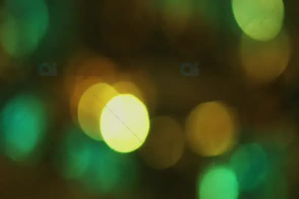 Soft Green and Yellow Bokeh with Glowing Light Orbs