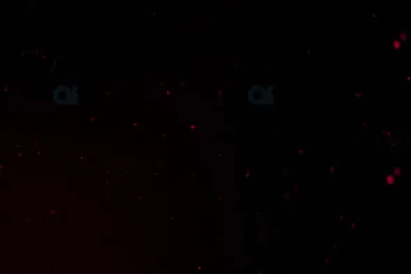 Subtle Red Glowing Particles Overlay on Black Background