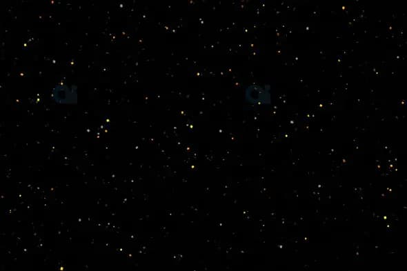 Scattered Glowing Particles on Black Background