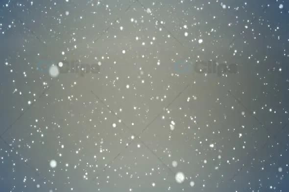 Soft Floating Snow Particles on a Light Grey Background