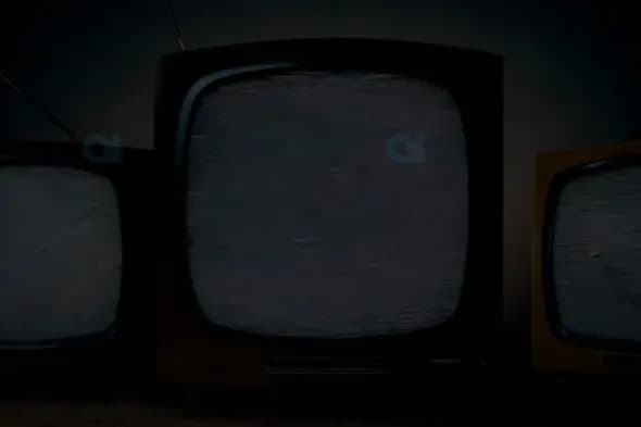 Vintage Televisions with Static on Screens in Dark Retro Setting
