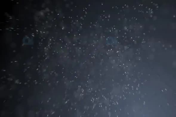 Soft Snowfall with Subtle Glow – Winter Particle Motion Background