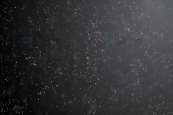 Backlit Snowfall in Soft Glow – Atmospheric Winter Particles