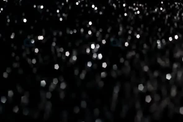 Elegant Silver Bokeh Lights on Black Background
