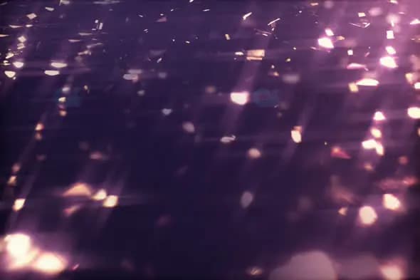 Shimmering Reflective Particles in Purple and Pink Glow