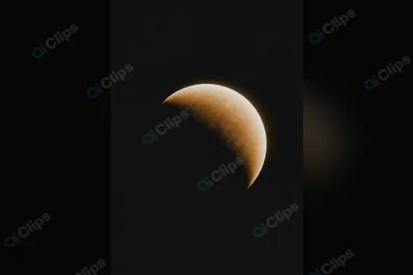 Crescent Moon with Detailed Surface Craters in Dark Sky