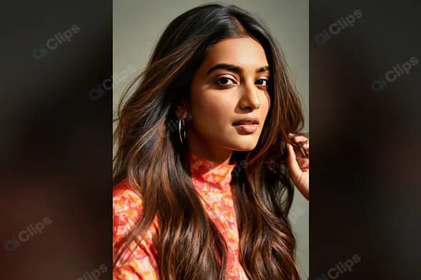 Stylish Indian Woman with Long Hair in Hoop Earrings and Floral Top