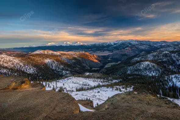 Breathtaking Snowy Mountain Range Panorama at Sunset