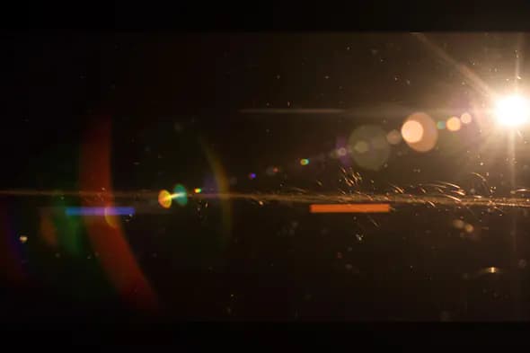 Realistic Lens Flare with Dust Particles for Cinematic Light Effects