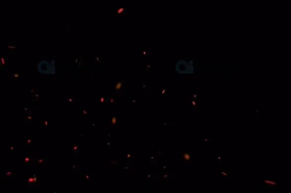 Glowing Ember Particles on Black Background