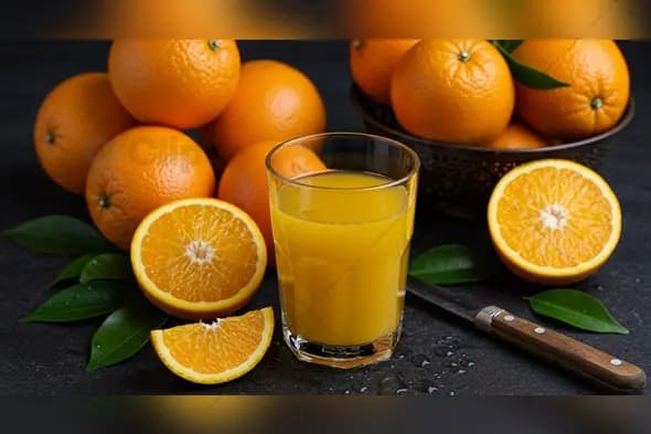 Fresh Orange Juice with Whole Oranges on Dark Surface
