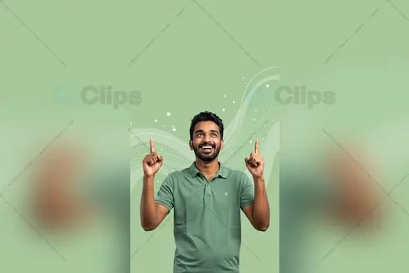 Happy Indian Man Pointing Up with Green Abstract Background