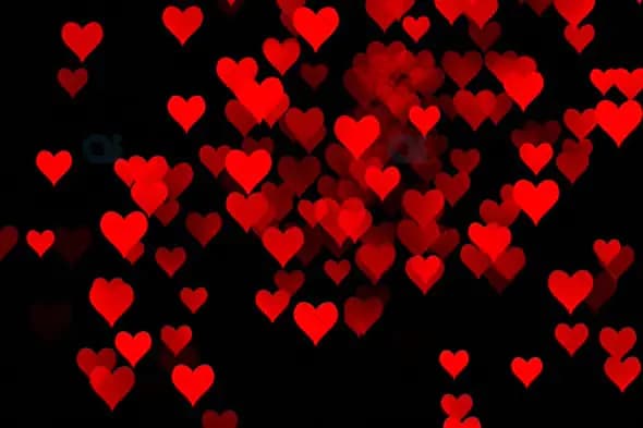 Dynamic Red Hearts Animation on Black Background