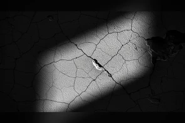 Cracked Wall Texture with Dramatic Light Shadow Overlay