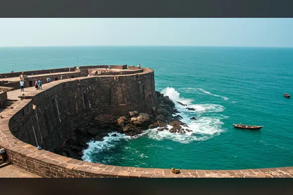 Historic Indian Sea Fort with Ocean Waves and Boats