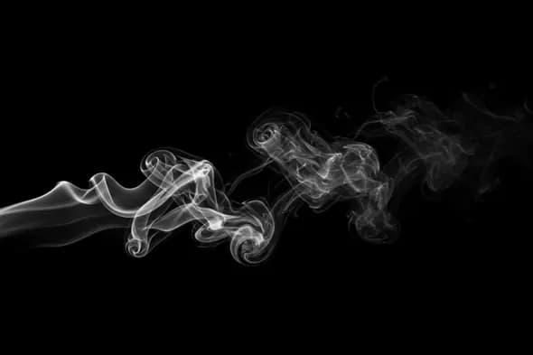 Curled White Smoke Trail Overlay on Black Background
