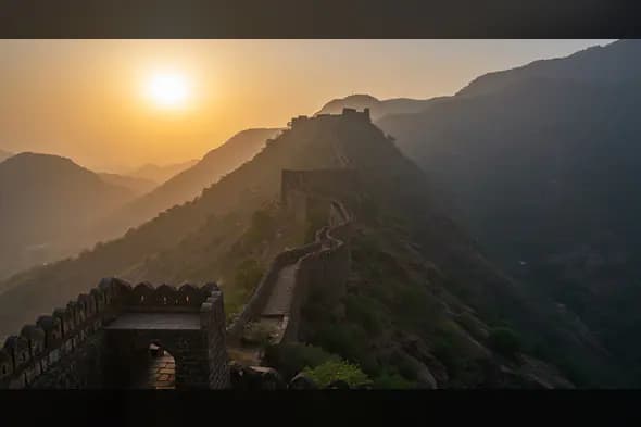 Sunset Over Ancient Indian Fort in Mountain Landscape