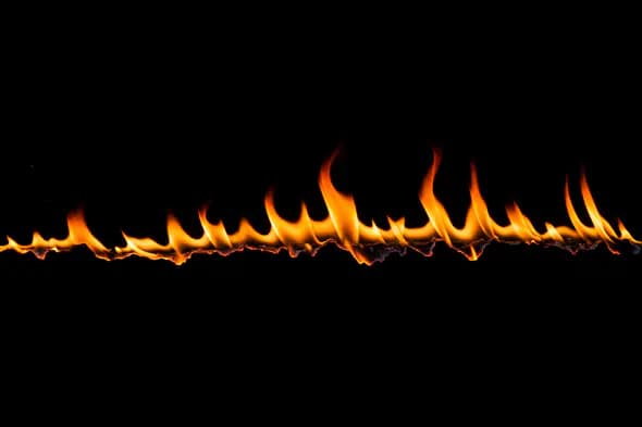 Sharp Rising Flame Line on Black Background