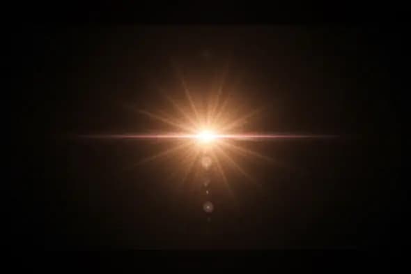 Golden Light Burst Lens Flare Effect on Dark Background