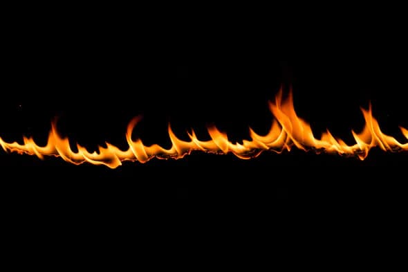 Horizontal Line of Flames on Black Background