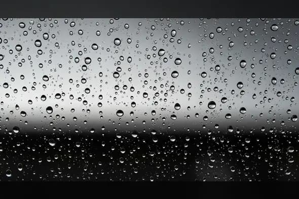 Realistic Rain Drops on Window Glass Texture Background