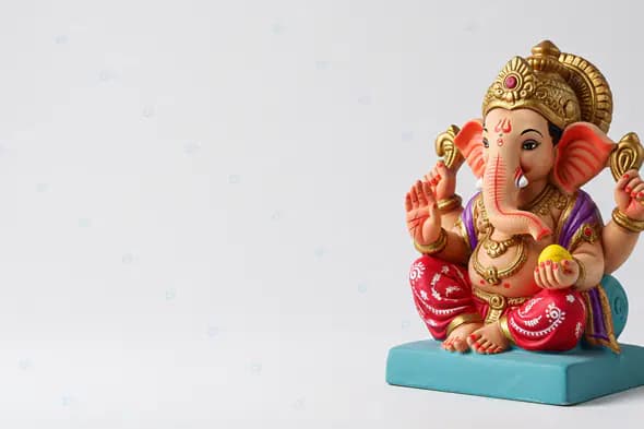Vibrant Ganesha Figurine on Turquoise Base