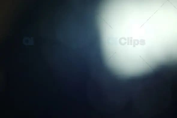 Soft White Light Bokeh on Dark Gradient Background