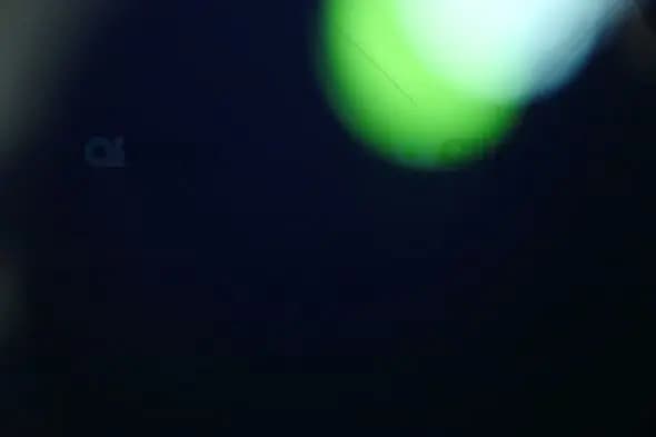 Abstract Green Light Bokeh on Dark Background