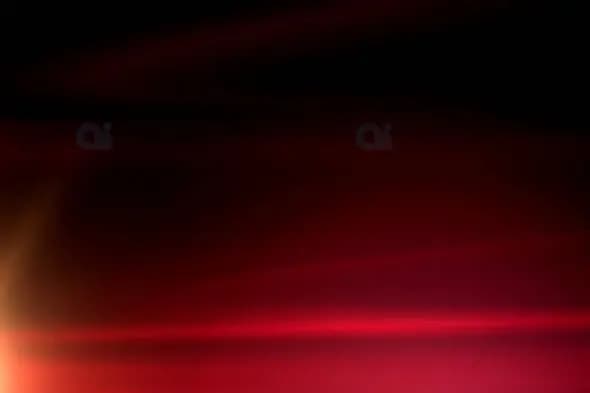 Dynamic Red Light Streaks on Black Backgroun