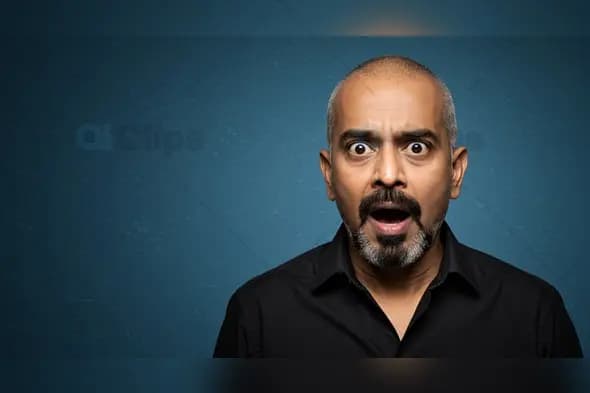 Shocked Indian Man on Textured Blue Background