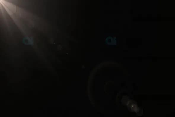 Subtle Light Rays with Lens Flares on Black Background
