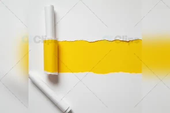 Torn White Paper Revealing Yellow Background Creative Concept