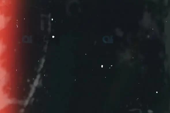 Grunge Film Texture with Red Glow and Dust Particles