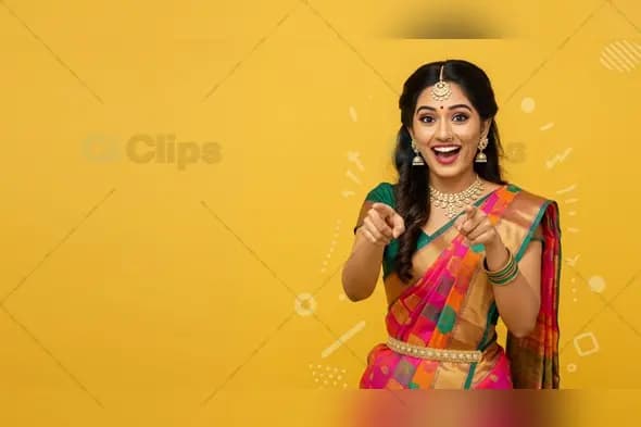 Smiling Indian Woman in Traditional Saree on Yellow