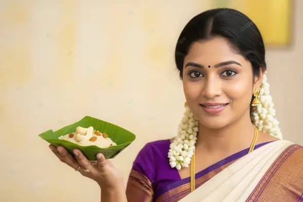 Indian Woman Offering a Traditional Delicacy