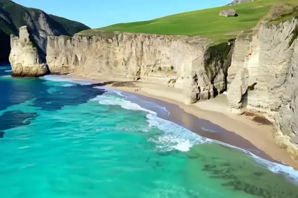 Turquoise Waters Meeting Limestone Cliffs at Secluded Beach