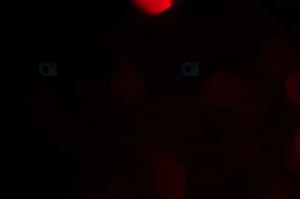 Red Bokeh Light Effects on Black Background