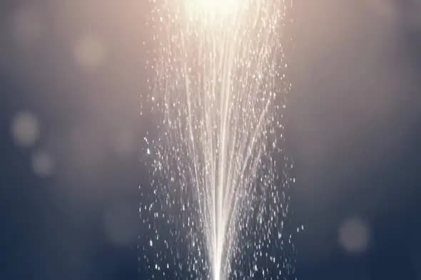 Elegant White Fountain Sparkler Effect Against Dark Background