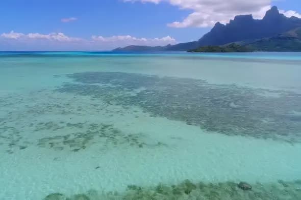 Pristine Turquoise Lagoon with Mountain Backdrop