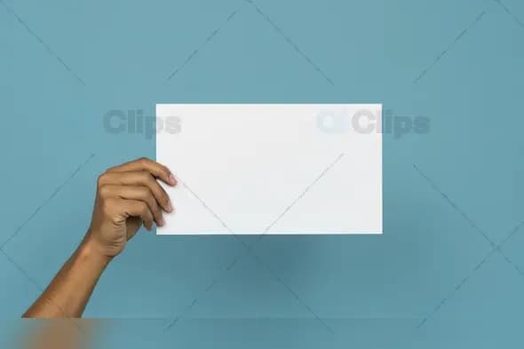 Hand Holding Blank White Card on Blue Background