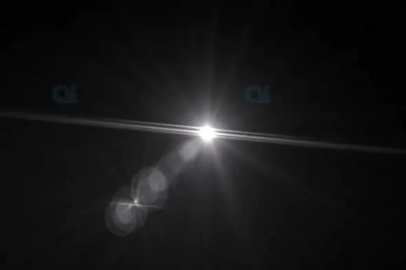Dynamic Lens Flare with Radiant Light on Black Background